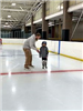 Father Assisting His Son in Skating