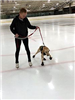 Benny Carefully Treading on the Ice with Their Trainer