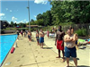 Attendees  Line the Edge of the Pool