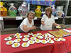 Volunteers Serve Slices of Cake
