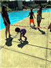 Young Kid Ducks Under the Limbo Bar