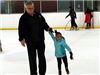 Dad and Daughter Skating on the Ice 2