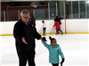 Dad and Daughter Skating on the Ice