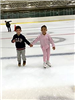 Siblings Skating While Holding Hands