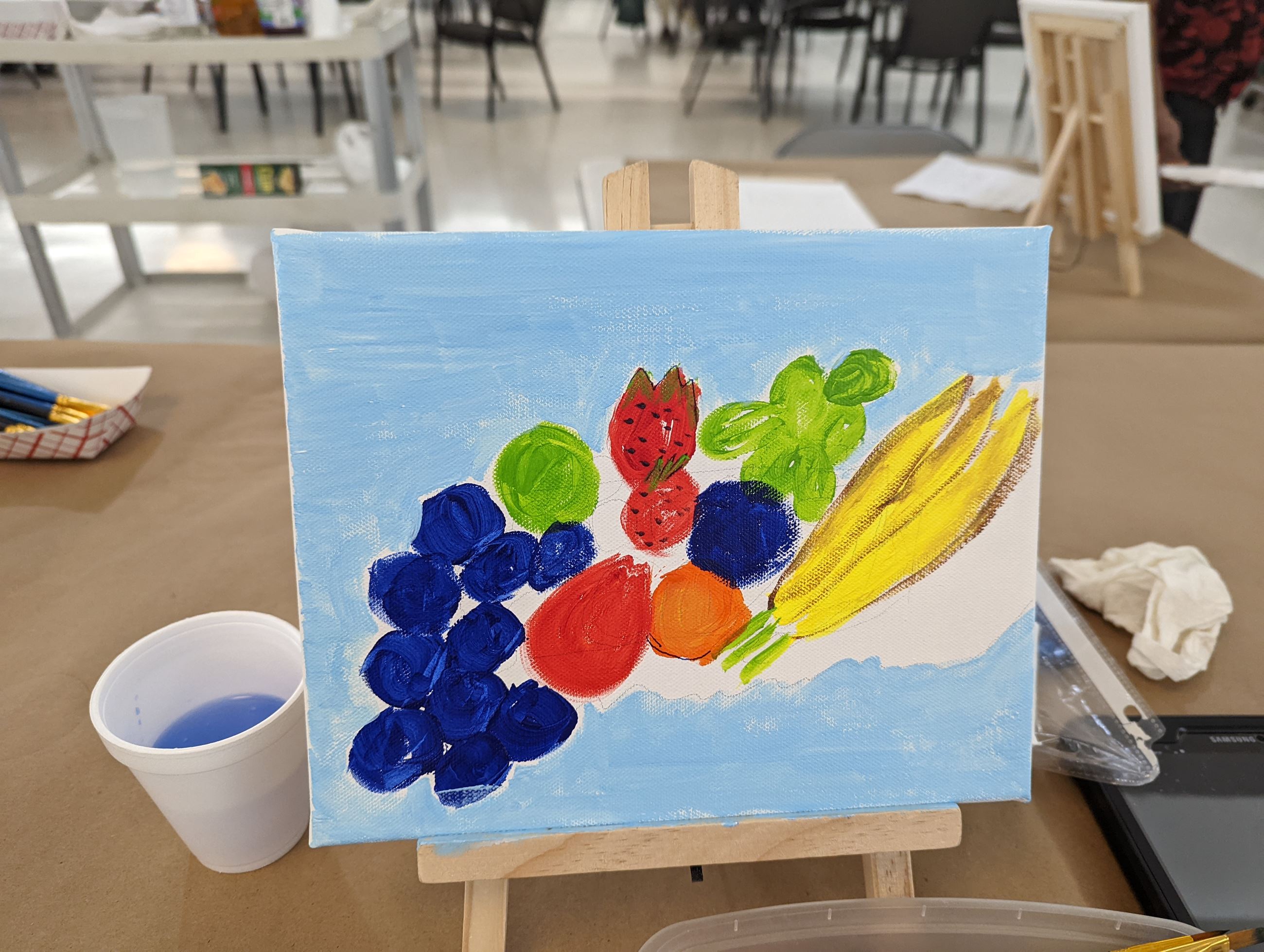 senior painting a picture