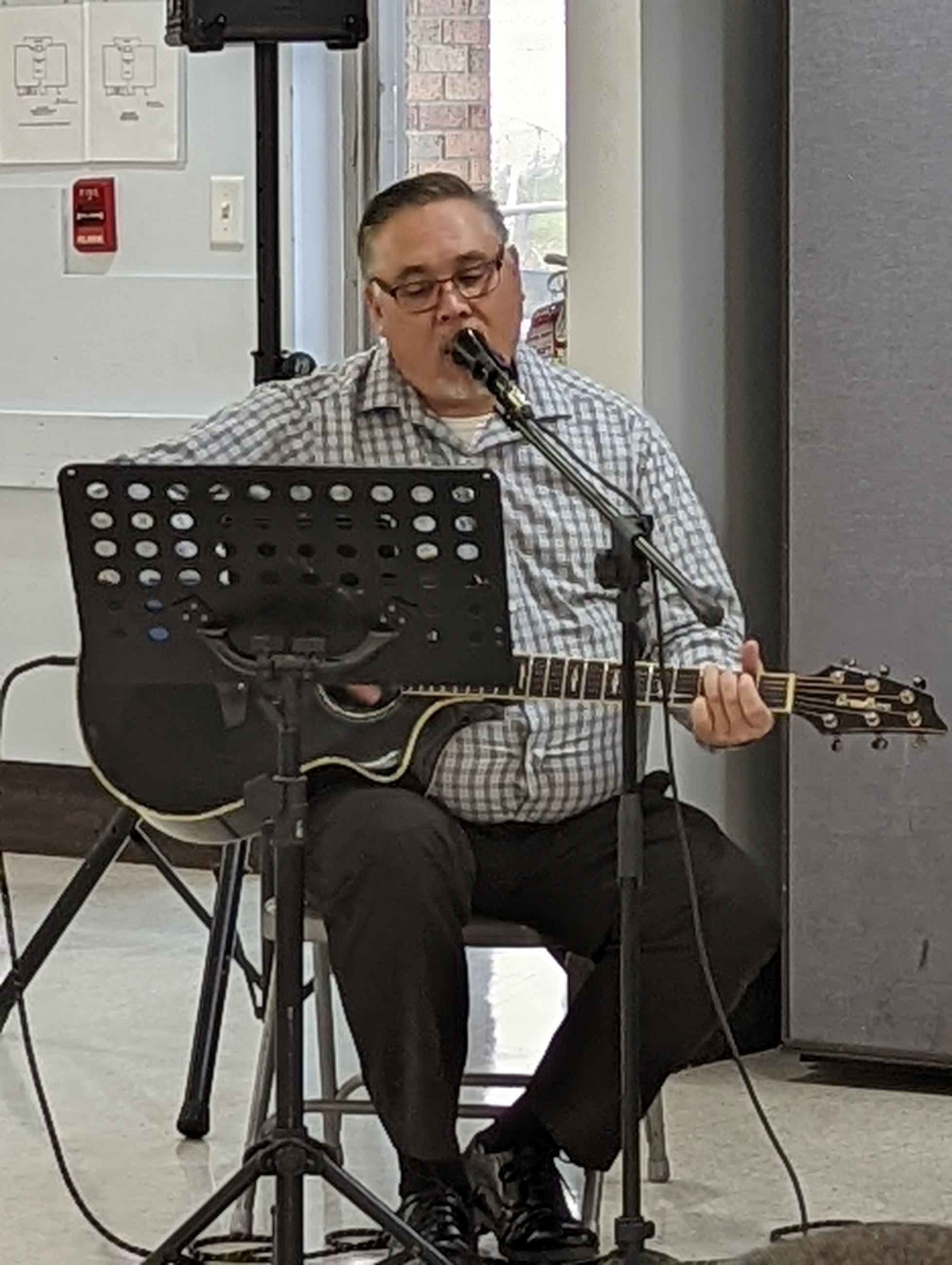 mayor burke playing guitar and singing 