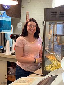Volunteer Serving Popcorn