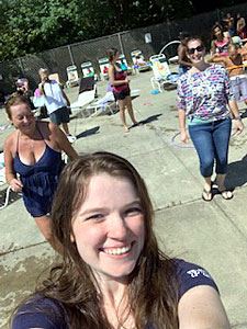 Woman Taking a Selfie with Other Attendees