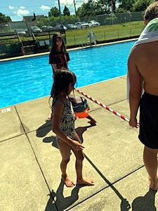 Young Girl Walking by the Limbo Area