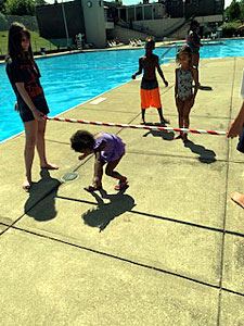 Young Kid Ducks Under the Limbo Bar