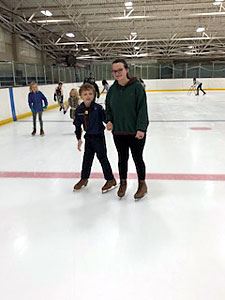 Siblings Skating Beside Each Other