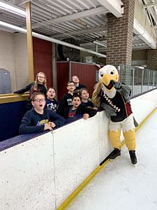 Kids and Bald Eagle Mascot Look at the Camera