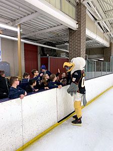 Kids Gather near a Mascot Character