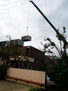 Crane Placing a Condenser on the Roof