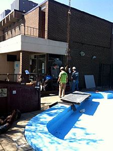 Workers Removing Old Equipment From the Recreation Center
